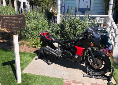 This poor, "Official Replica" Kawasaki Ninja is getting stripped for parts.